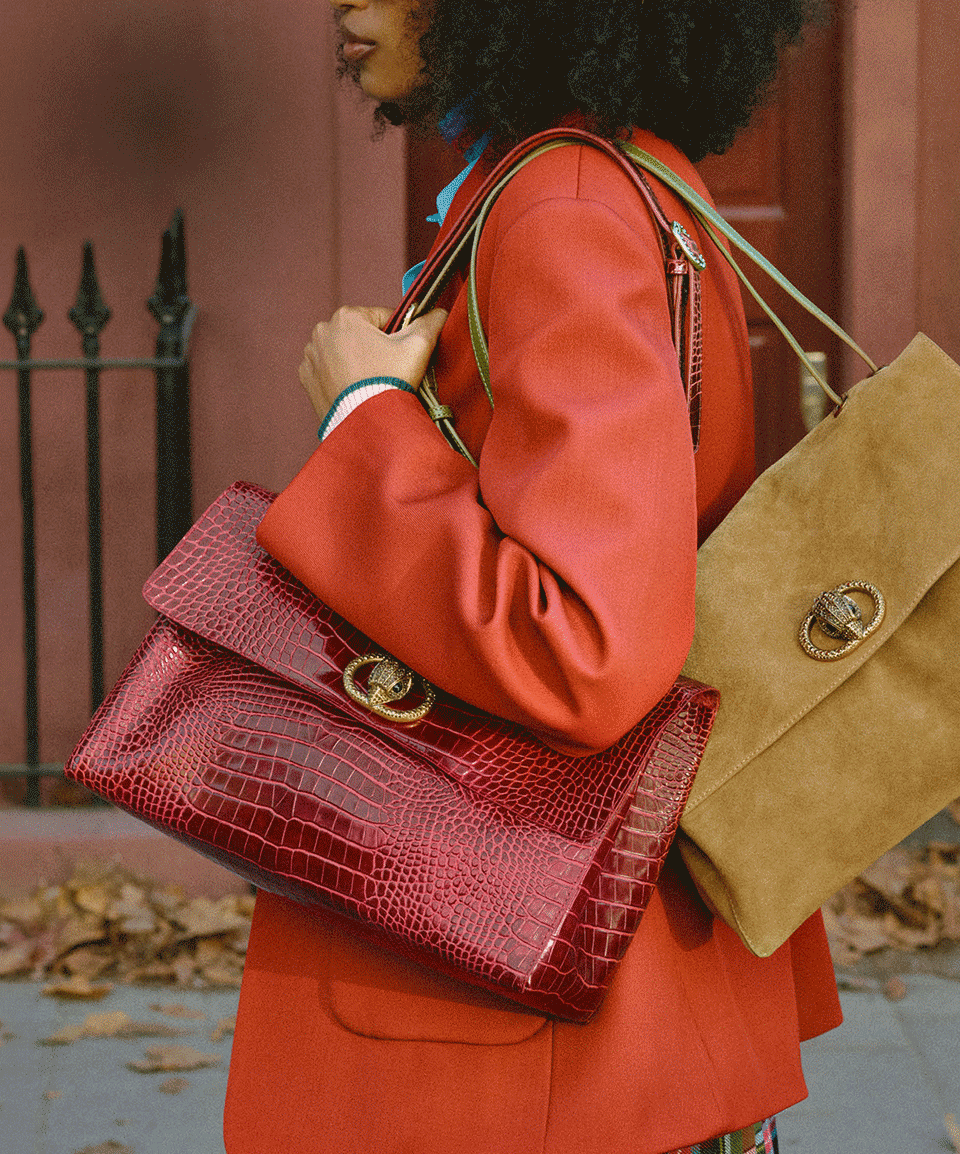 Woman carrying Kurt Geiger bags